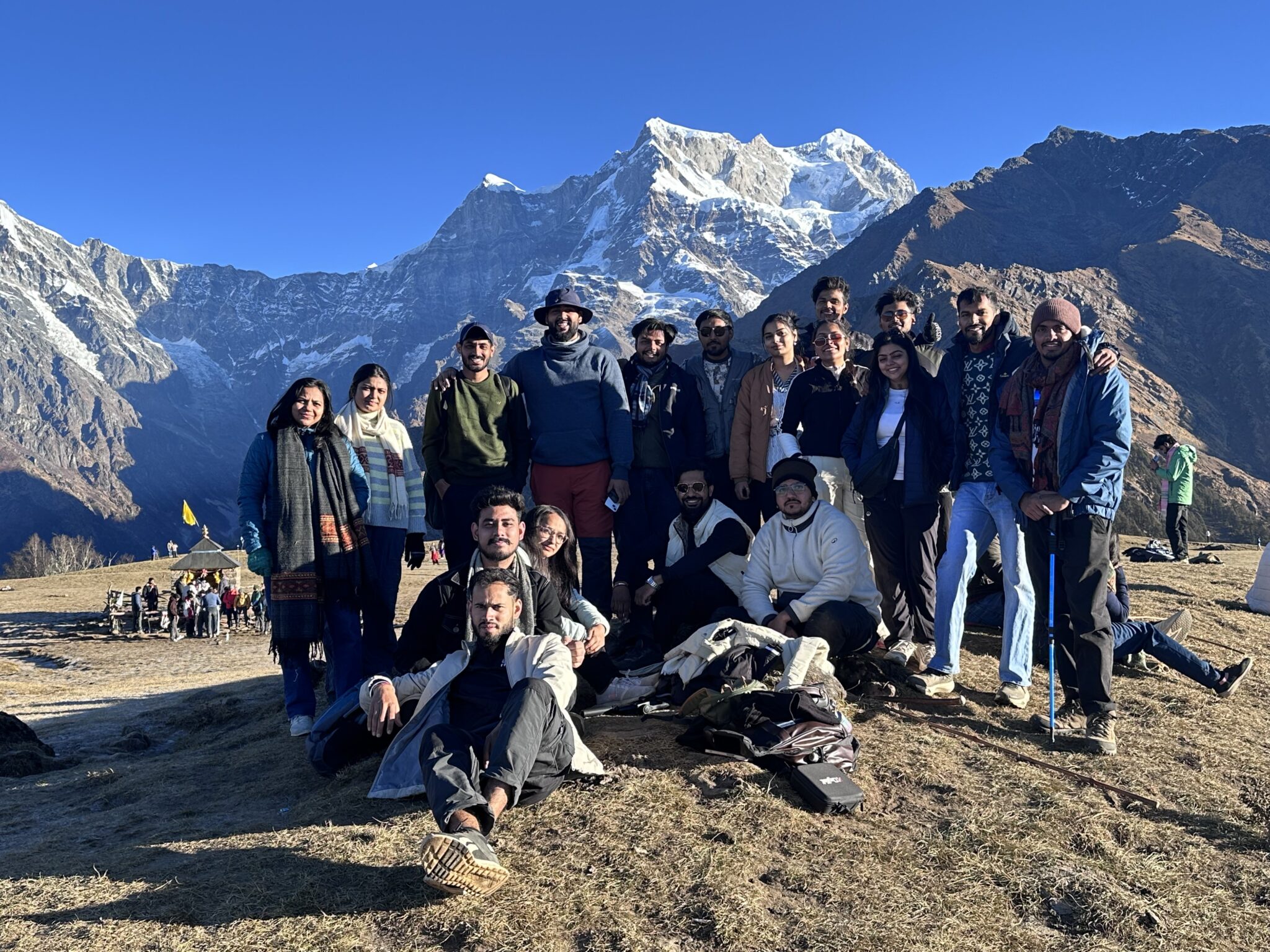 Group of trekkers resting on the way to Madmaheshwar Temple